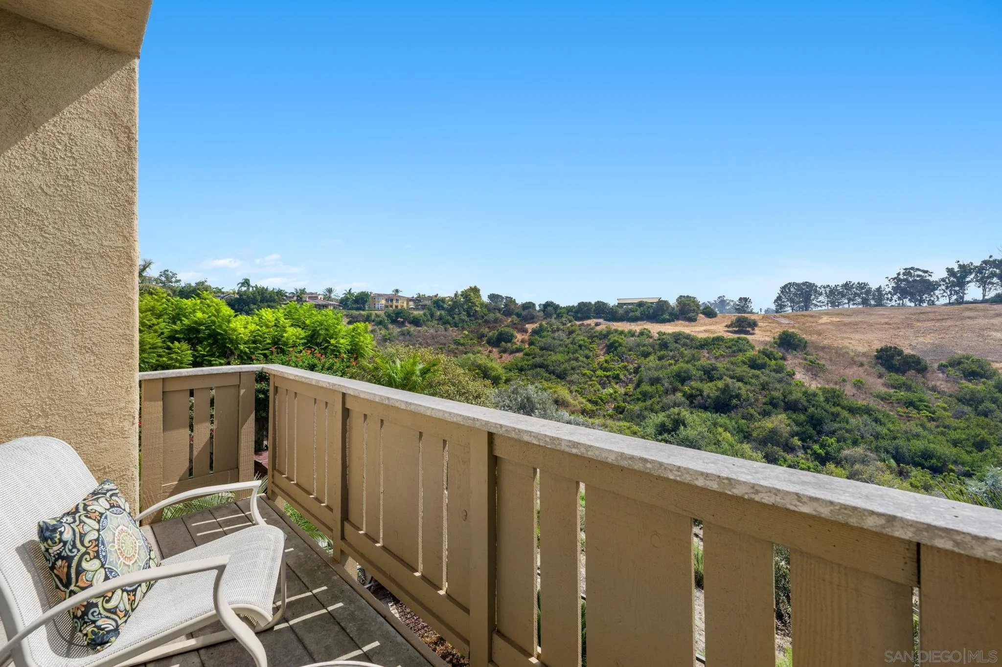 1369 Ranch Road Encinitas, CA 92024 - Photo 25 of 34 a view of a balcony with couches and wooden floor