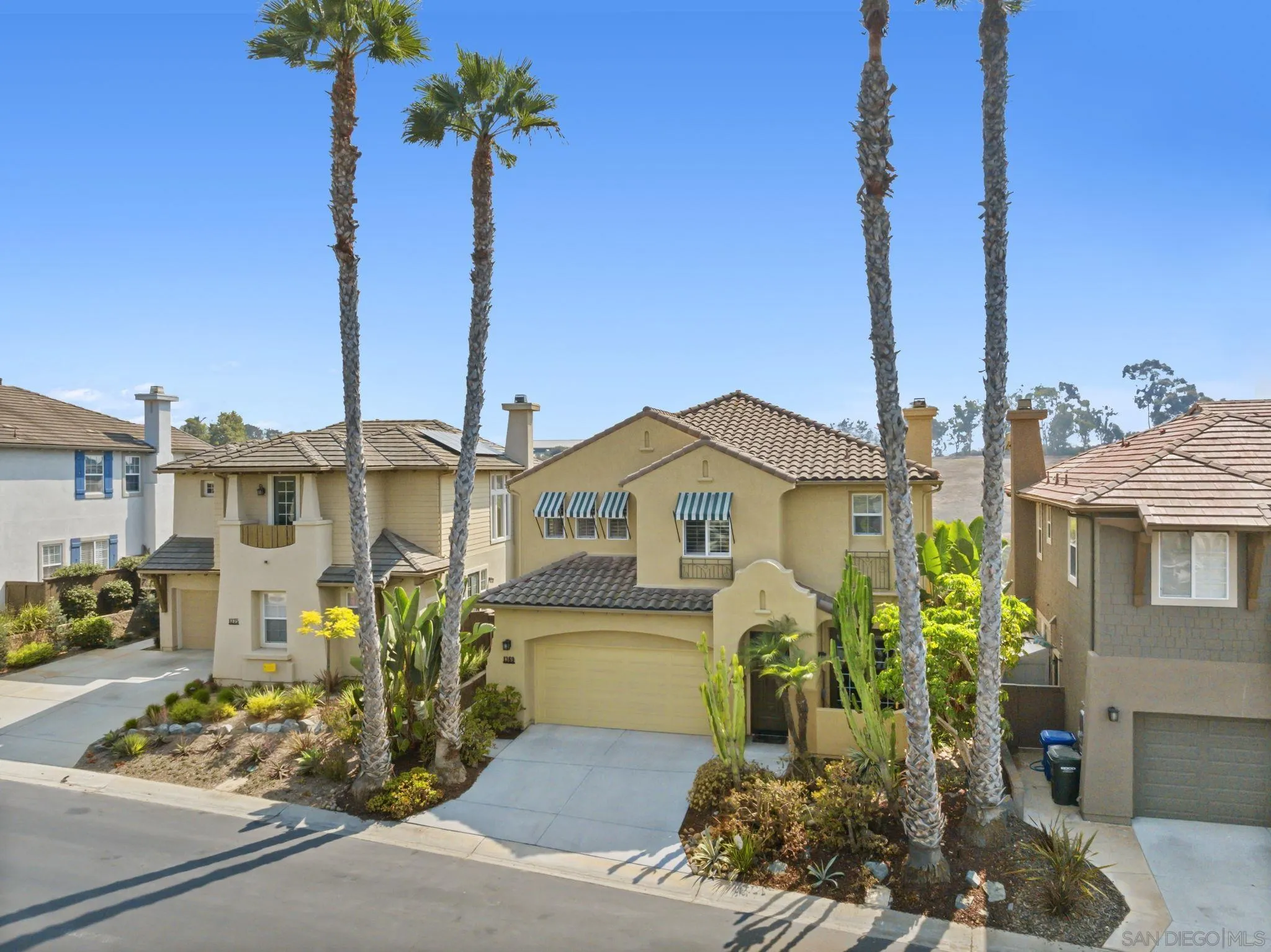 1369 Ranch Road Encinitas, CA 92024 - Photo 32 of 34 a front view of a house with a garden