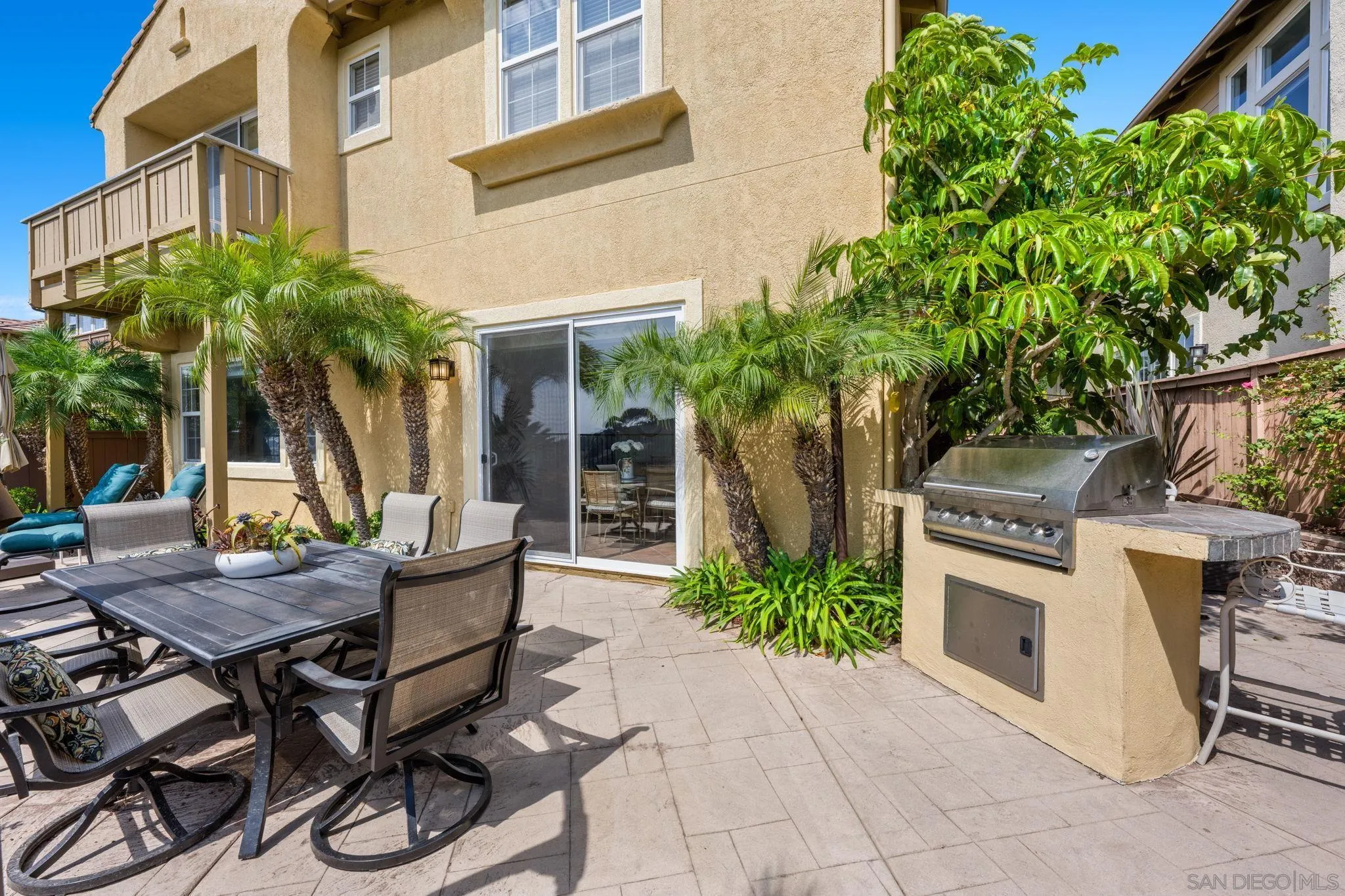 1369 Ranch Road Encinitas, CA 92024 - Photo 4 of 34 a view of a patio with table and chairs and potted plants