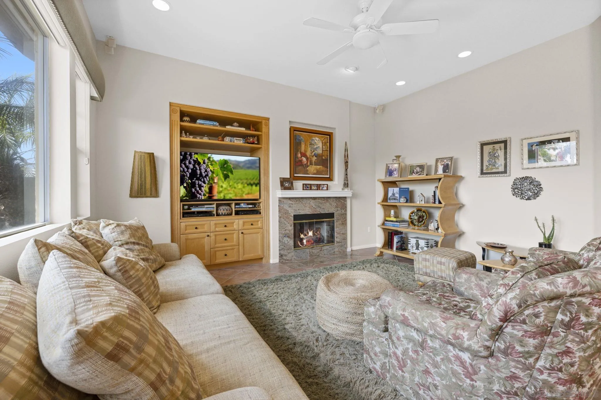 1369 Ranch Road Encinitas, CA 92024 - Photo 6 of 34 a living room with furniture a window and a fireplace