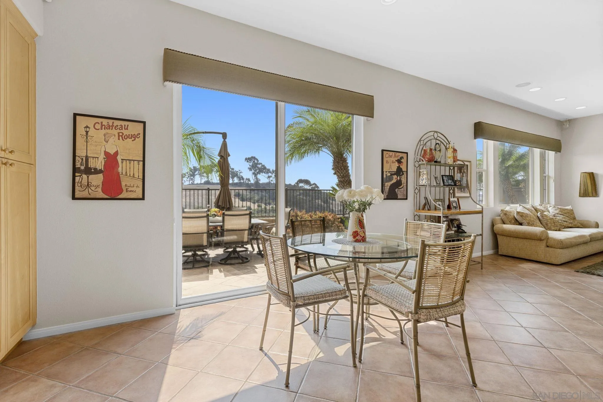 1369 Ranch Road Encinitas, CA 92024 - Photo 7 of 34 a dining room with furniture and a floor to ceiling window