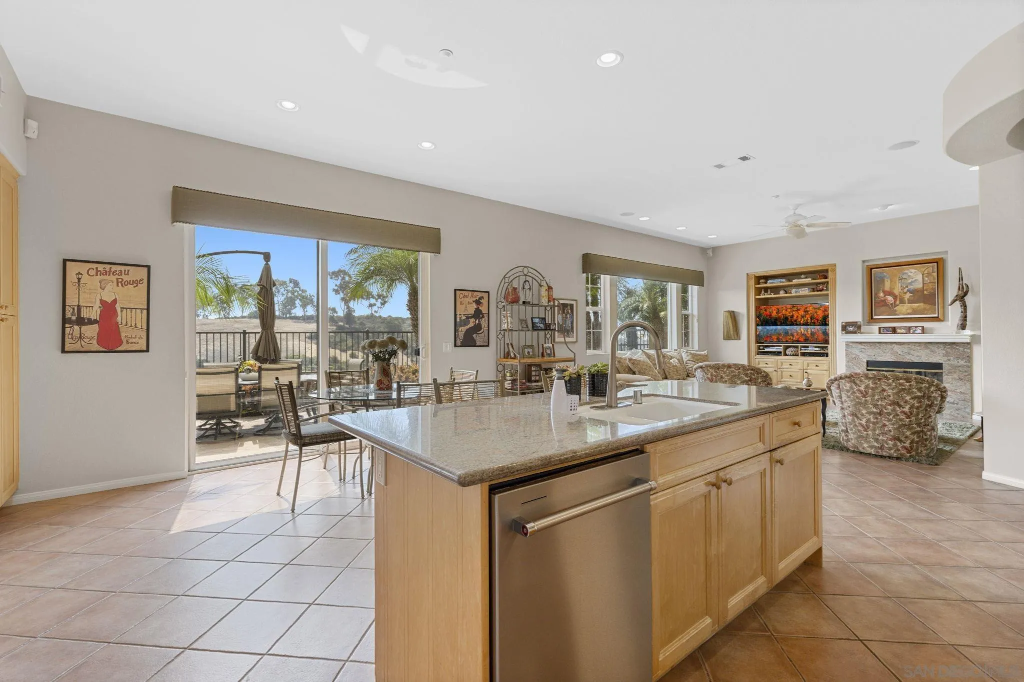 1369 Ranch Road Encinitas, CA 92024 - Photo 10 of 34 a kitchen with stainless steel appliances granite countertop a sink and cabinets