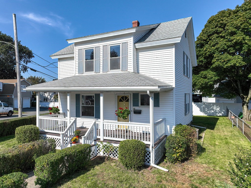 12 Ballard Street Saugus, MA 01906 - Photo 1 of 38 a front view of a house with a yard