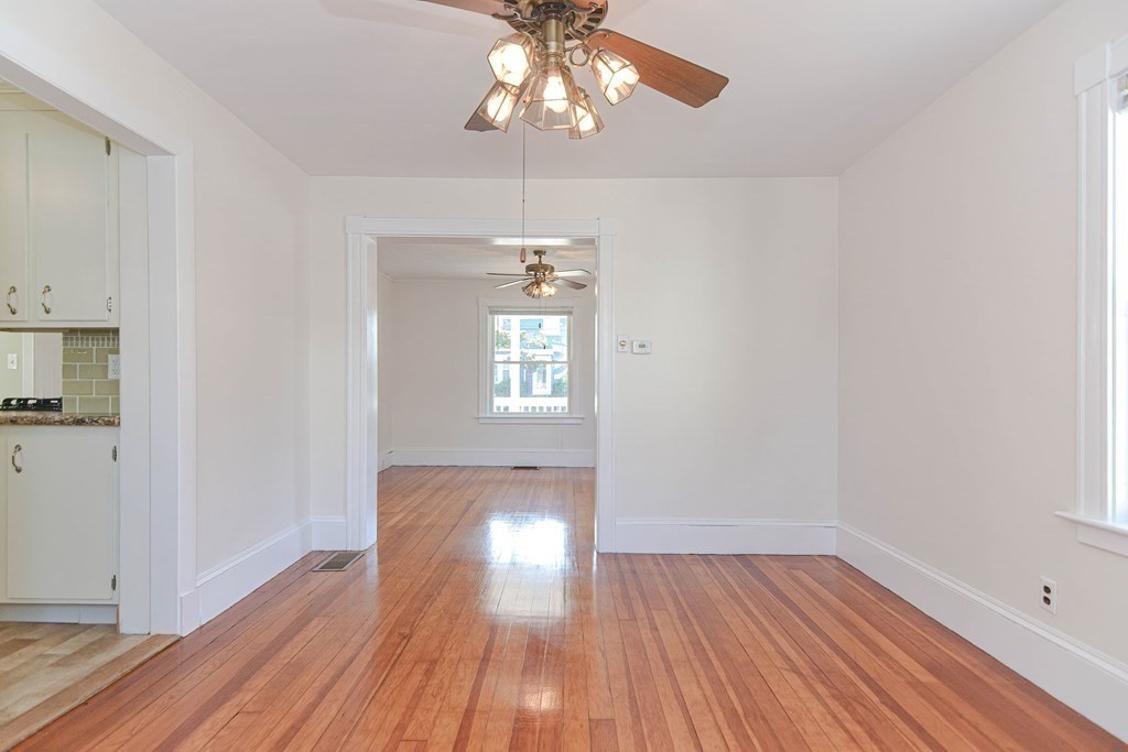 12 Ballard Street Saugus, MA 01906 - Photo 11 of 38 wooden floor in an empty room with a window
