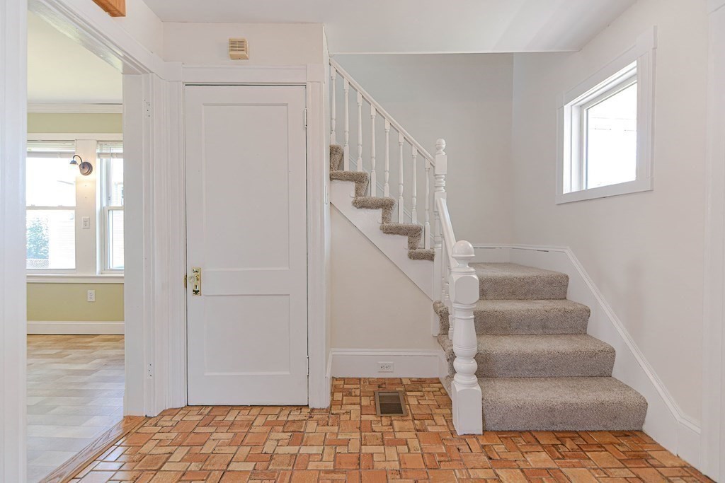 12 Ballard Street Saugus, MA 01906 - Photo 15 of 38 a view of staircase with white walls and windows