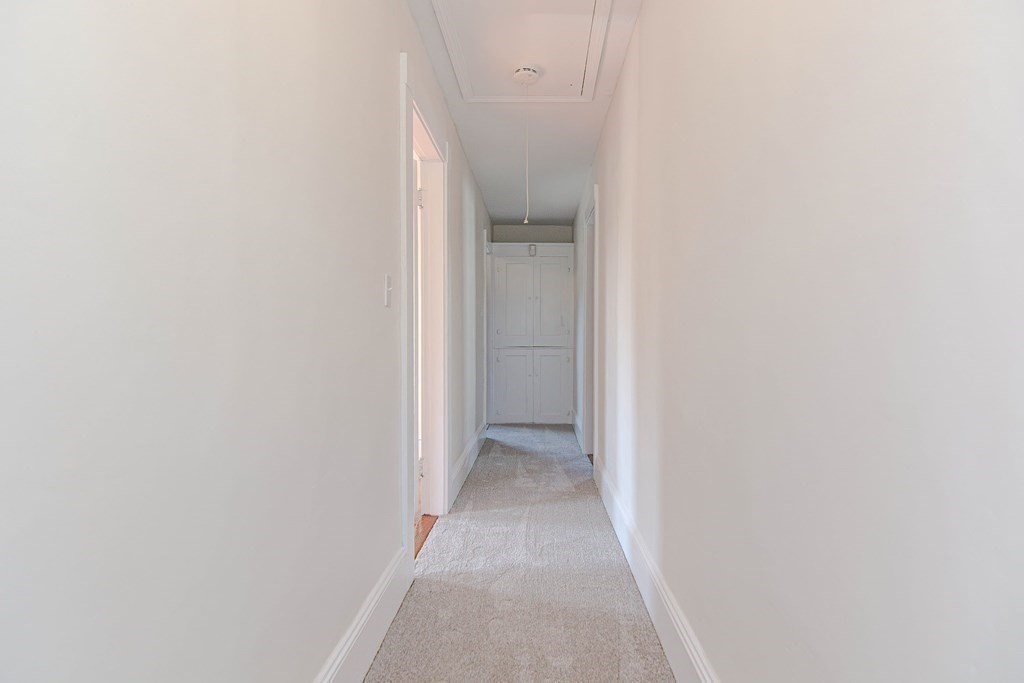 12 Ballard Street Saugus, MA 01906 - Photo 19 of 38 a view of a hallway with closet