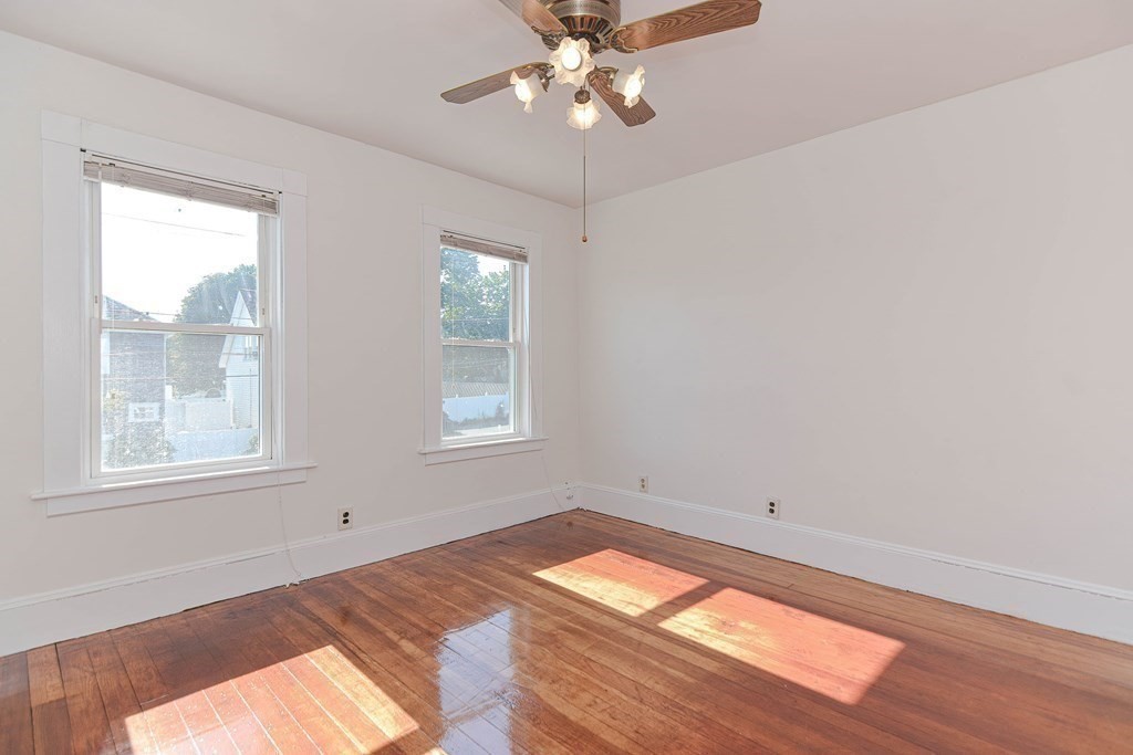 12 Ballard Street Saugus, MA 01906 - Photo 21 of 38 wooden floor in an empty room with a window