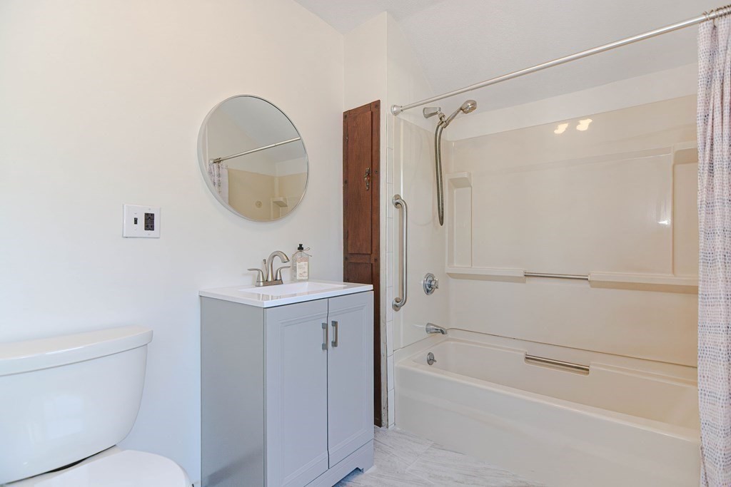 12 Ballard Street Saugus, MA 01906 - Photo 25 of 38 a bathroom with a sink a toilet and shower