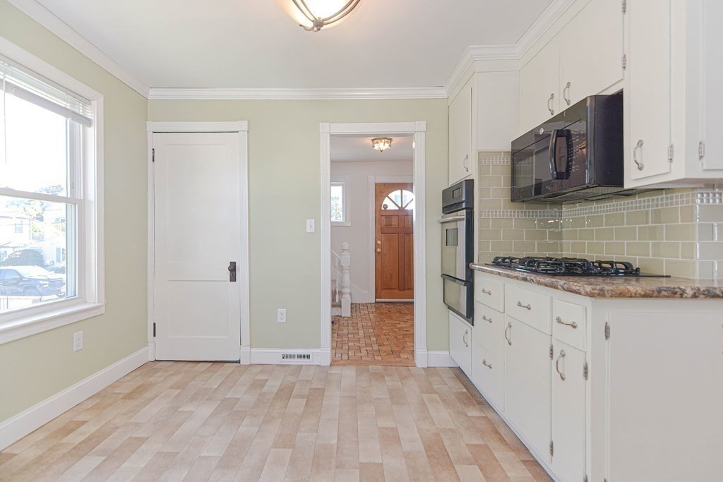 12 Ballard Street Saugus, MA 01906 - Photo 29 of 38 a view of a kitchen with cabinets