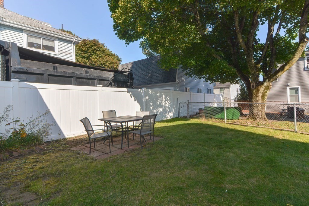 12 Ballard Street Saugus, MA 01906 - Photo 33 of 38 a view of backyard of house with seating space
