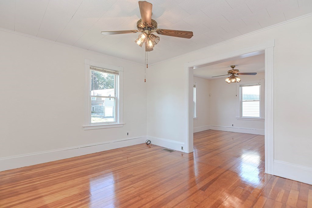 12 Ballard Street Saugus, MA 01906 - Photo 10 of 38 wooden floor in an empty room with a window