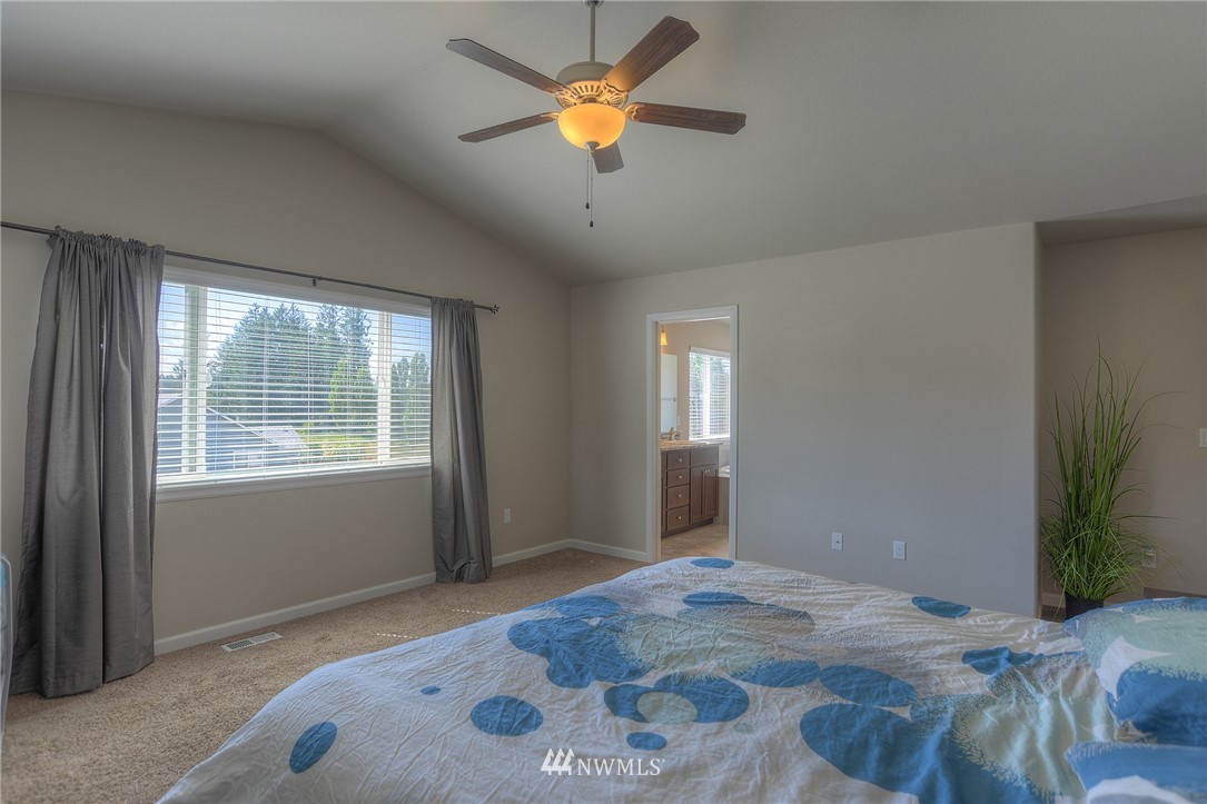 4745 Rosa Court Lacey, WA 98503 - Photo 14 of 25 a bedroom with bed and a window