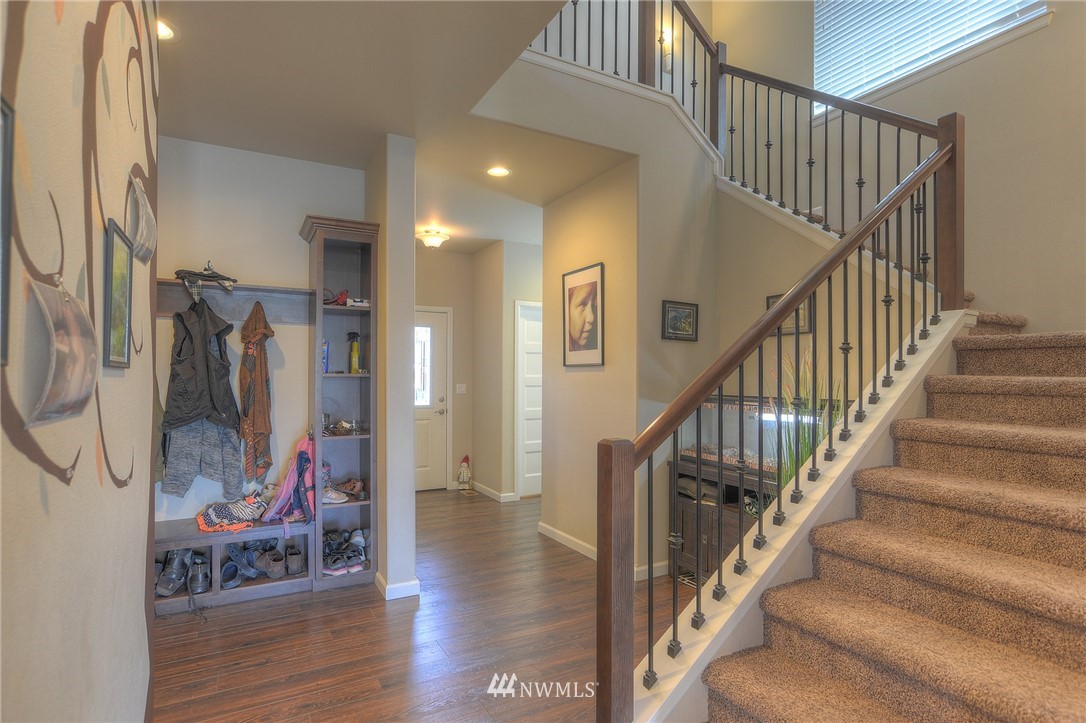 4745 Rosa Court Lacey, WA 98503 - Photo 3 of 25 a view of entryway with wooden floor and stairs