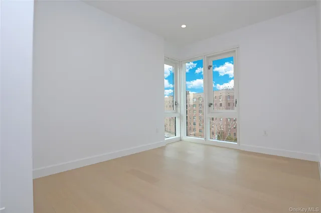a kitchen with a refrigerator sink and cabinets