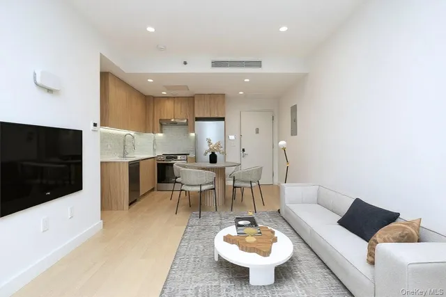 a spacious bedroom with a bed and a large window