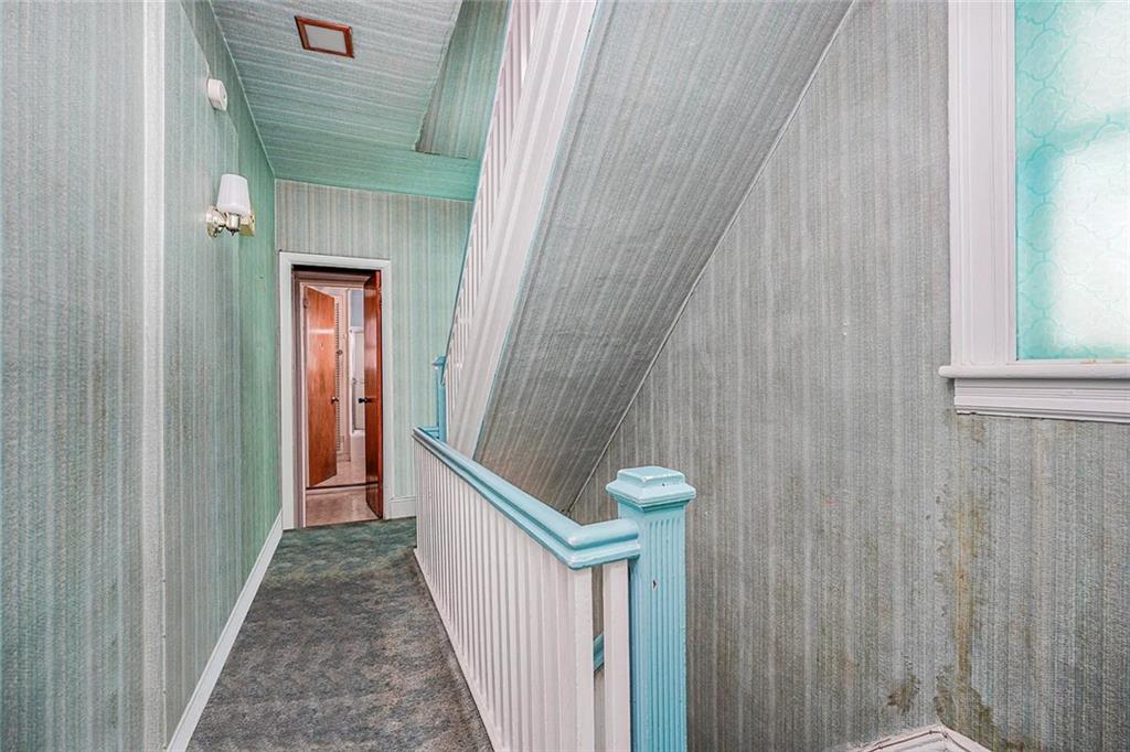 222 Albemarle Road Brooklyn, NY 11218 - Photo 11 of 41 a view of a hallway with wooden floor and staircase