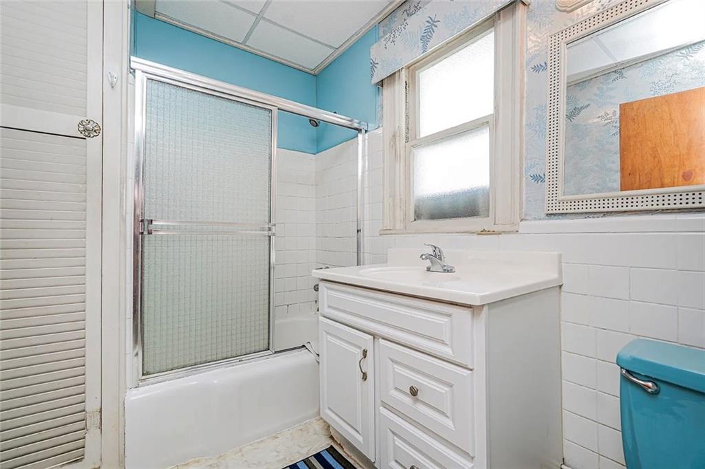 222 Albemarle Road Brooklyn, NY 11218 - Photo 17 of 41 a bathroom with a sink a toilet and shower