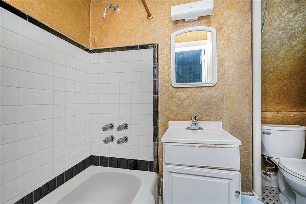 222 Albemarle Road Brooklyn, NY 11218 - Photo 18 of 41 a bathroom with a sink toilet and shower