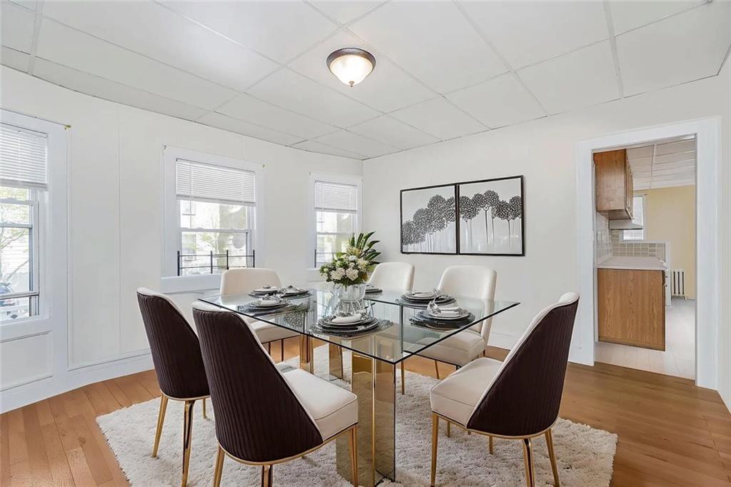 222 Albemarle Road Brooklyn, NY 11218 - Photo 24 of 41 a dining room with furniture and wooden floor