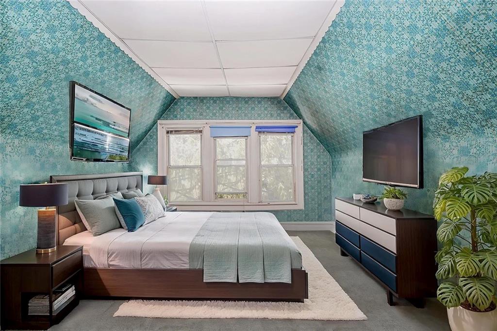 222 Albemarle Road Brooklyn, NY 11218 - Photo 25 of 41 a spacious bedroom with a bed and a flat screen tv