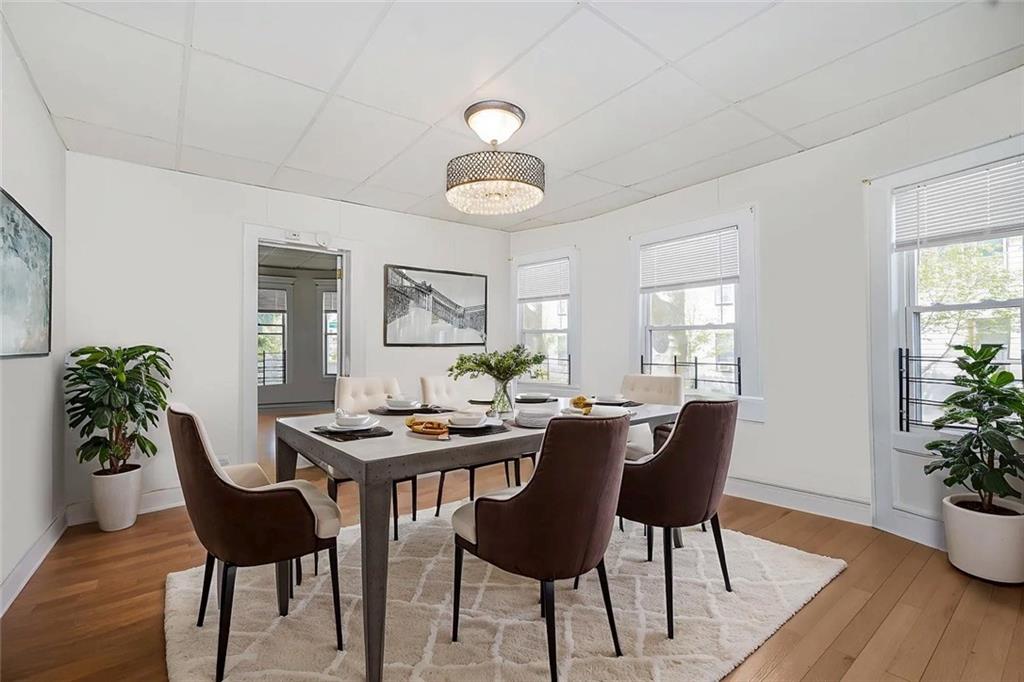 222 Albemarle Road Brooklyn, NY 11218 - Photo 26 of 41 a dining room with furniture potted plants and wooden floor