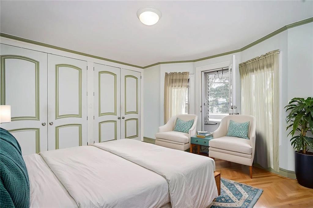222 Albemarle Road Brooklyn, NY 11218 - Photo 27 of 41 a bedroom with a balcony a bed and a couch