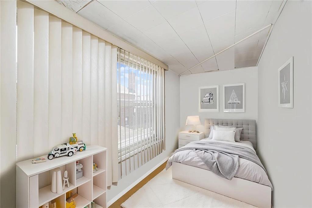 222 Albemarle Road Brooklyn, NY 11218 - Photo 29 of 41 a bedroom with a bed and a window