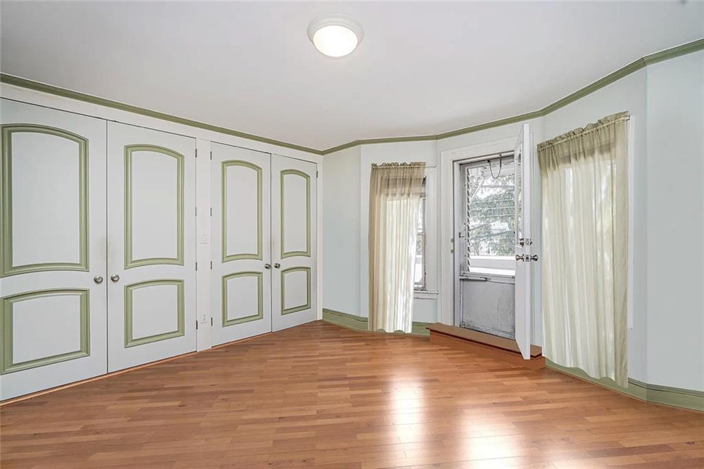 222 Albemarle Road Brooklyn, NY 11218 - Photo 31 of 41 a view of empty room with wooden floor and fan