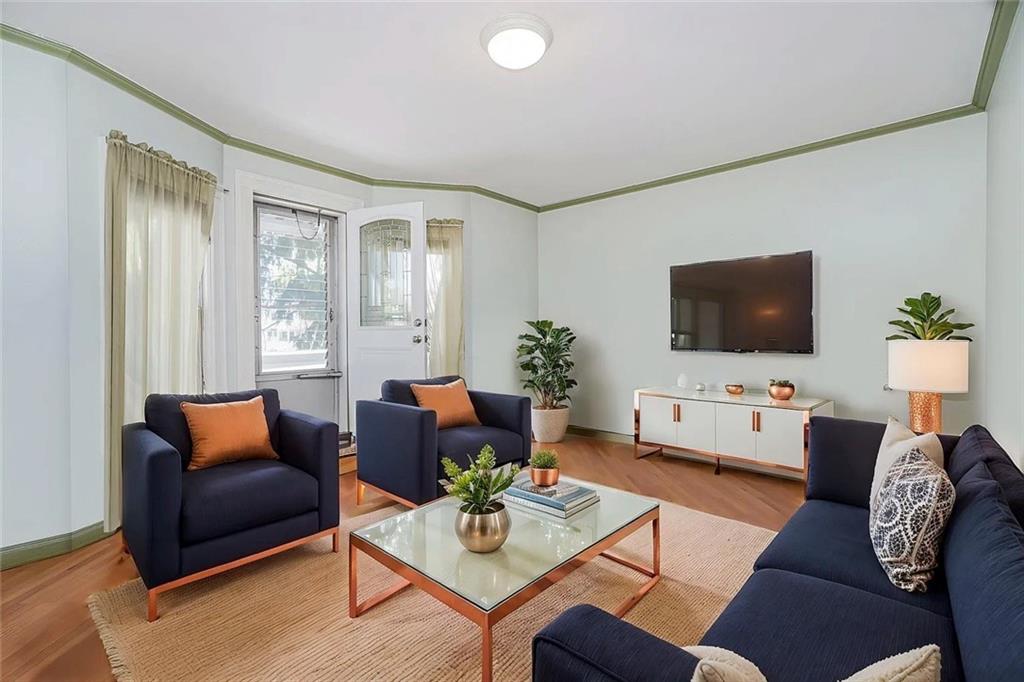 222 Albemarle Road Brooklyn, NY 11218 - Photo 32 of 41 a living room with furniture and a flat screen tv