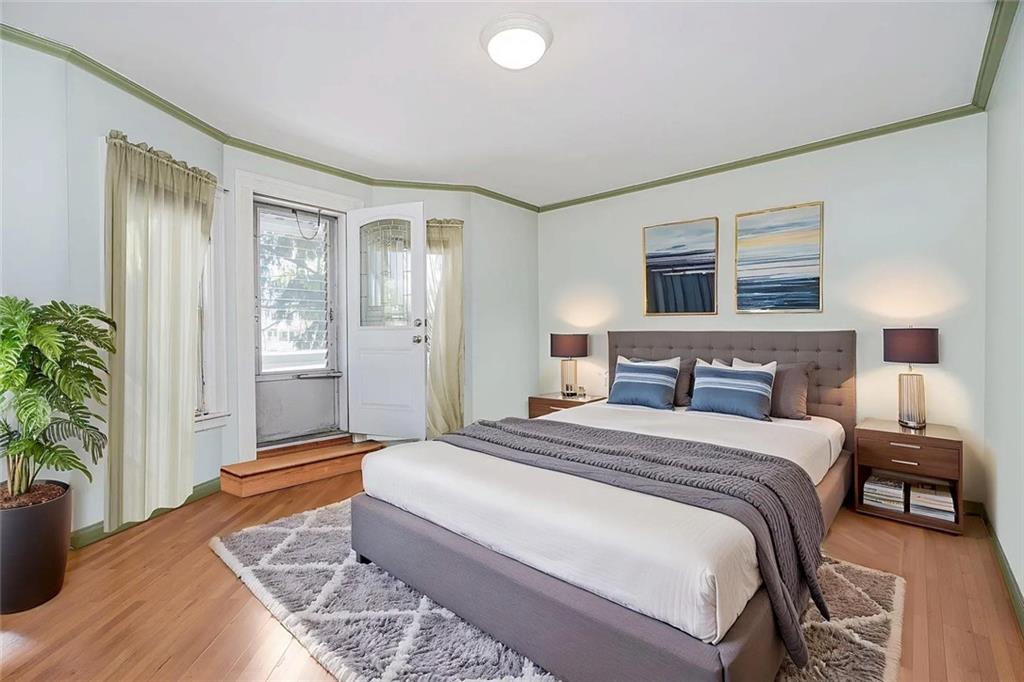 222 Albemarle Road Brooklyn, NY 11218 - Photo 33 of 41 a spacious bedroom with a large bed and a potted plant