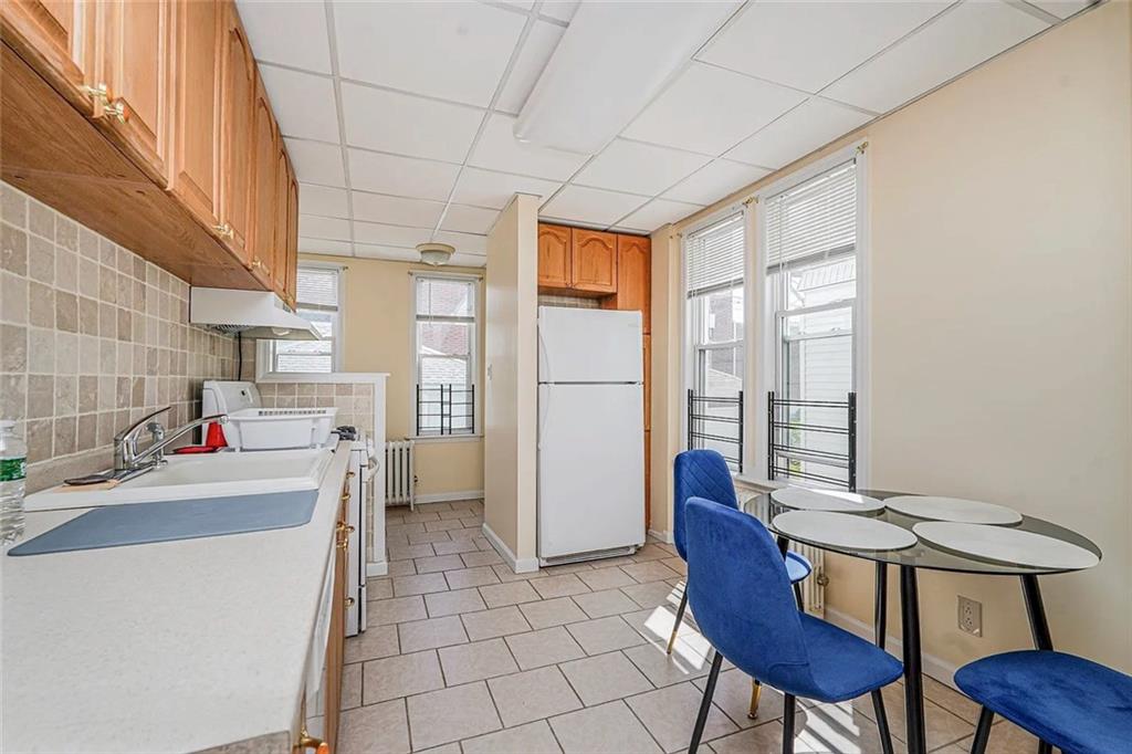 222 Albemarle Road Brooklyn, NY 11218 - Photo 8 of 41 a view of kitchen with furniture and a refrigerator