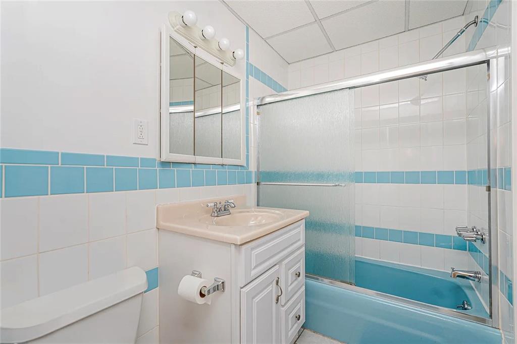 222 Albemarle Road Brooklyn, NY 11218 - Photo 9 of 41 a bathroom with a sink a mirror and a shower
