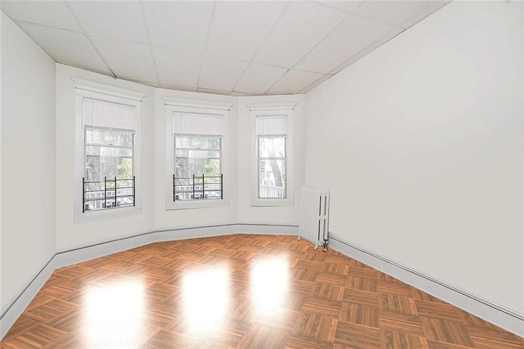 222 Albemarle Road Brooklyn, NY 11218 - Photo 10 of 41 a view of empty room with wooden floor and fan