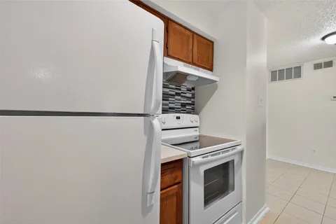 a bathroom with a bathtub and toilet