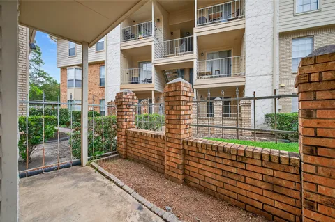 a balcony with view of outdoor space