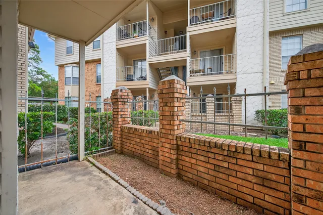 a balcony with view of outdoor space