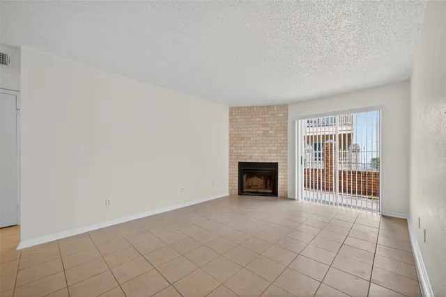 an empty room with fireplace