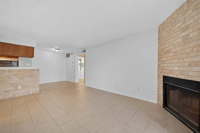 a view of a kitchen cabinets and a fireplace
