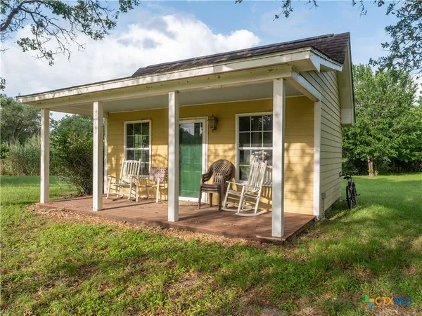 a view of outdoor space with deck and yard