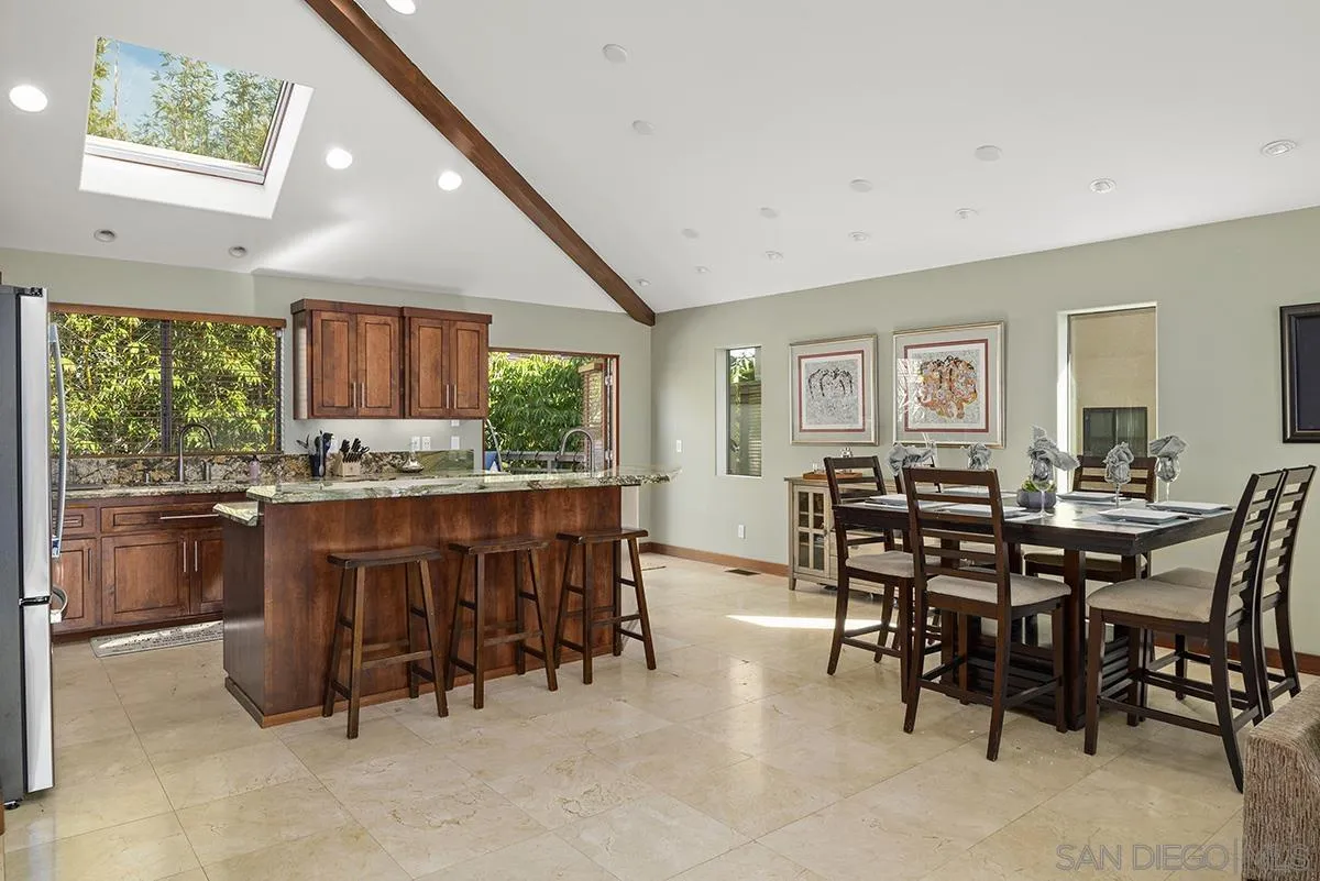 13613 Mar Scenic Drive Del Mar, CA 92014 - Photo 14 of 46 a kitchen with a table and chairs in it