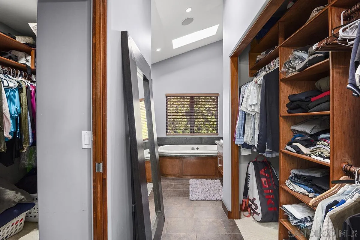 13613 Mar Scenic Drive Del Mar, CA 92014 - Photo 26 of 46 a view of walk in closet with clothes and shoes