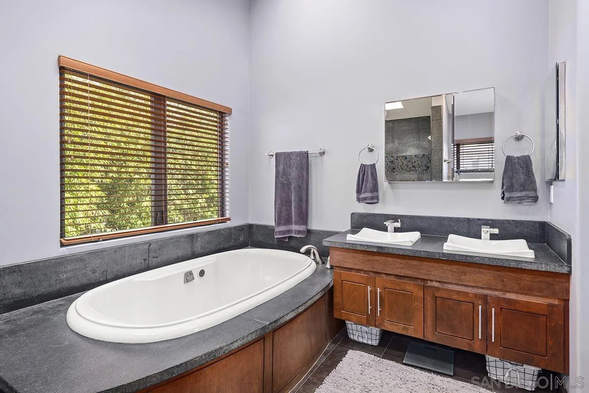 13613 Mar Scenic Drive Del Mar, CA 92014 - Photo 27 of 46 a bathroom with a granite countertop sink and a bathtub
