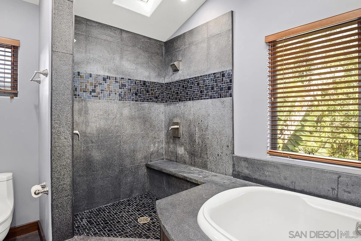 13613 Mar Scenic Drive Del Mar, CA 92014 - Photo 28 of 46 a bathroom with a bathtub and shower