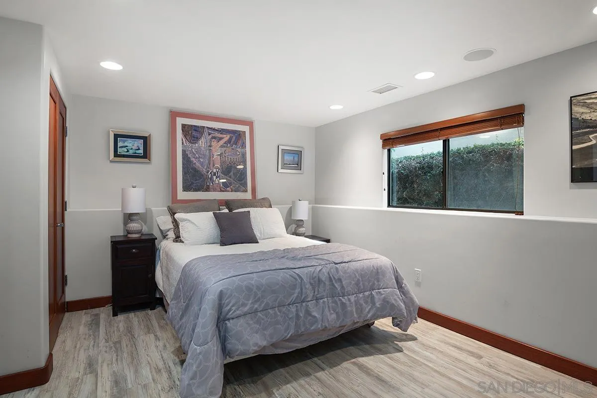 13613 Mar Scenic Drive Del Mar, CA 92014 - Photo 29 of 46 a bedroom with a large bed and a large window