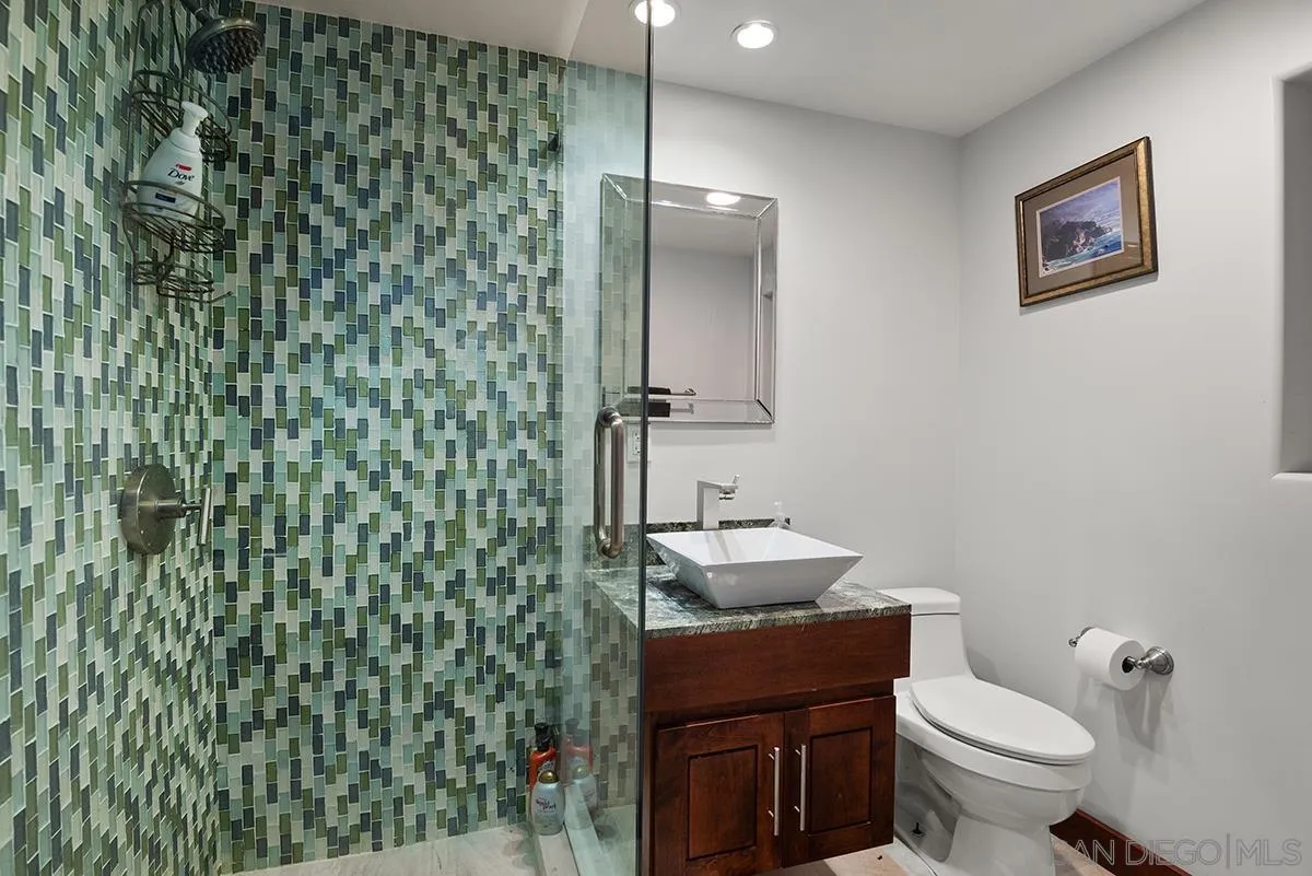 13613 Mar Scenic Drive Del Mar, CA 92014 - Photo 30 of 46 a bathroom with a toilet a sink and mirror