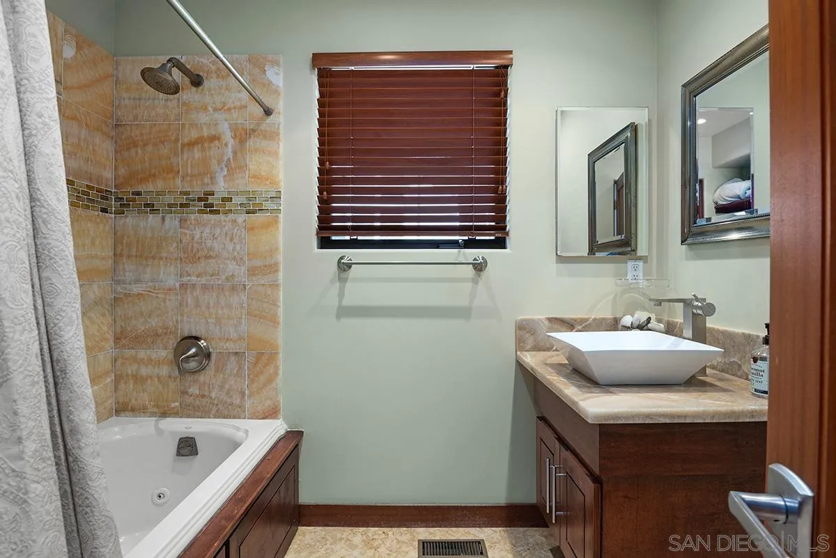 13613 Mar Scenic Drive Del Mar, CA 92014 - Photo 32 of 46 a bathroom with a sink and a bathtub