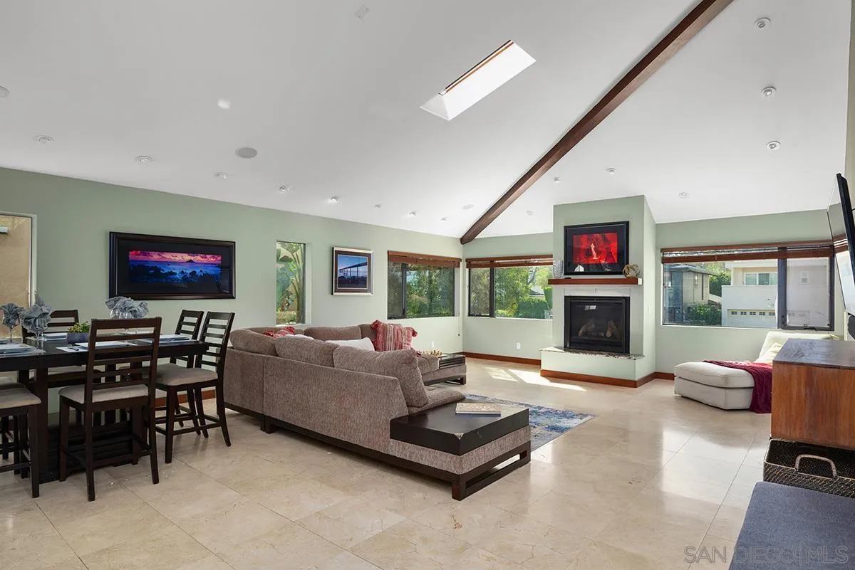 13613 Mar Scenic Drive Del Mar, CA 92014 - Photo 7 of 46 a living room with furniture flat screen tv and a fireplace