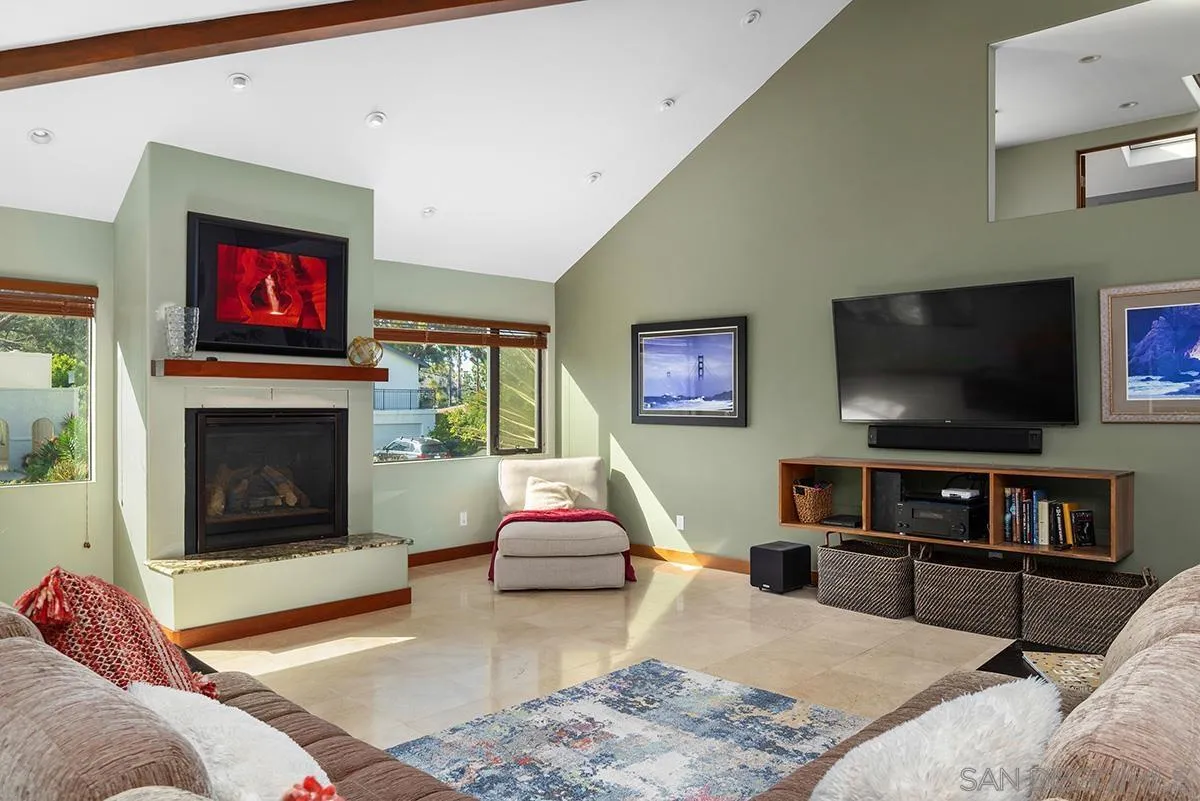 13613 Mar Scenic Drive Del Mar, CA 92014 - Photo 9 of 46 a living room with furniture and a flat screen tv