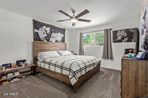 9001 North 13th Avenue Phoenix, AZ 85021 - Photo 16 of 25 a spacious bedroom with a bed and window