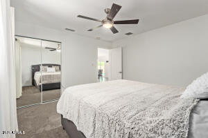 9001 North 13th Avenue Phoenix, AZ 85021 - Photo 19 of 25 a bedroom with a bed and a large mirror